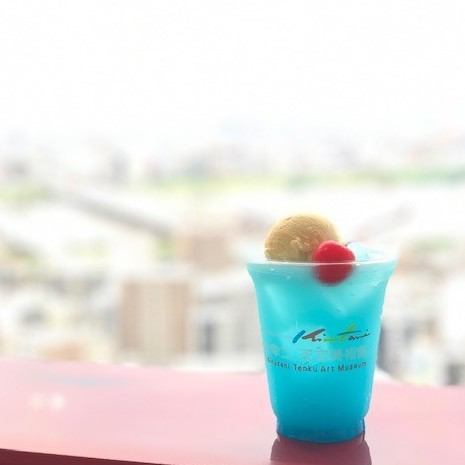 Light blue soda inspired by the sky, topped with ice cream that looks like clouds.