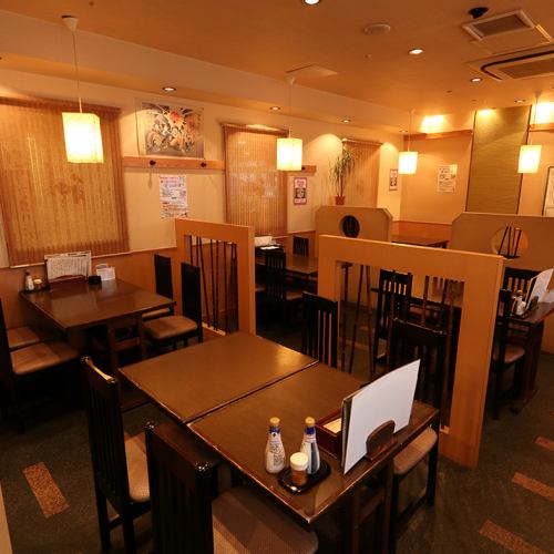 A spacious interior with Japanese-style lights gently lit