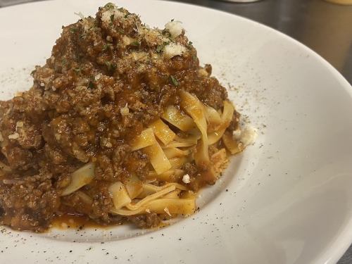 Bolognese slowly stewed with tomatoes and red wine
