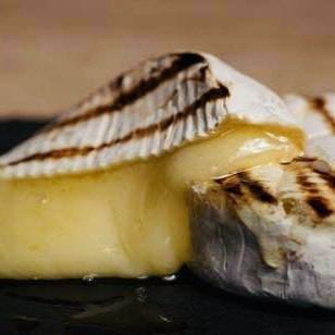 Grilled camembert cheese with garlic butter