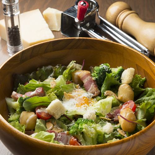Caesar salad with thickly sliced bacon ~ topped with hot spring egg ~
