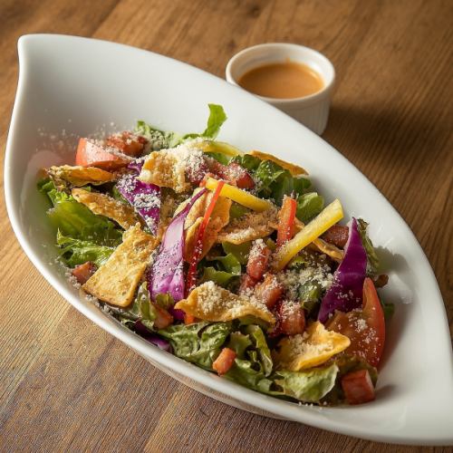 Mexican salad with bacon and tortilla chips