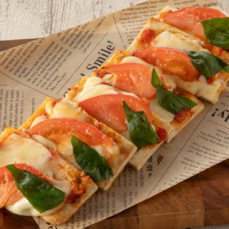 Margherita pizza with mozzarella and tomato