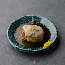 Homemade chicken meatballs with cheese, grilled over charcoal