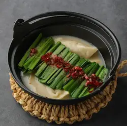 Dumplings boiled in rich white broth