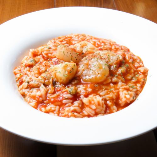 Seafood risotto with tomato sauce