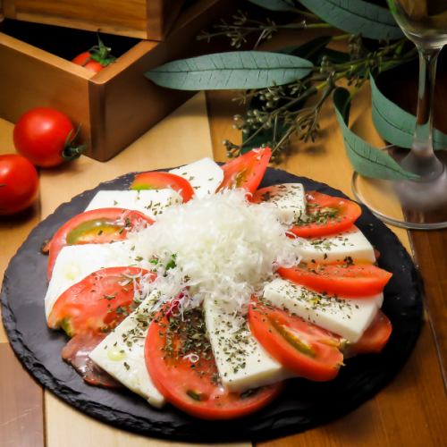 Caprese made with local Wakamatsu tomatoes and mozzarella