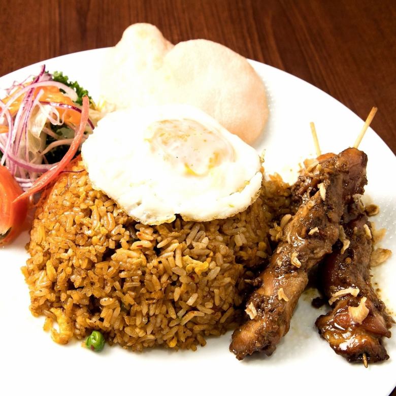 Nasi goreng with grilled egg and satin chicken