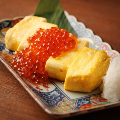 Rolled egg with salmon roe