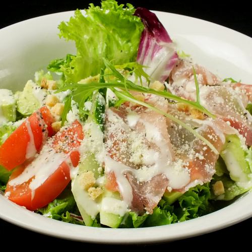 Caesar salad of raw ham and avocado