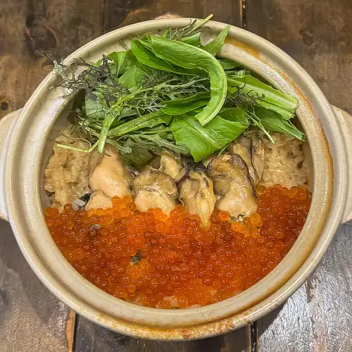 Seasonal freshly cooked rice in an earthenware pot
