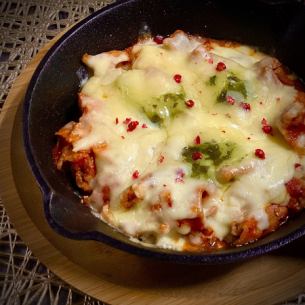 Oven-baked pork, tomato and cheese