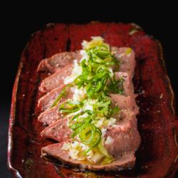 Liver covered in green onions