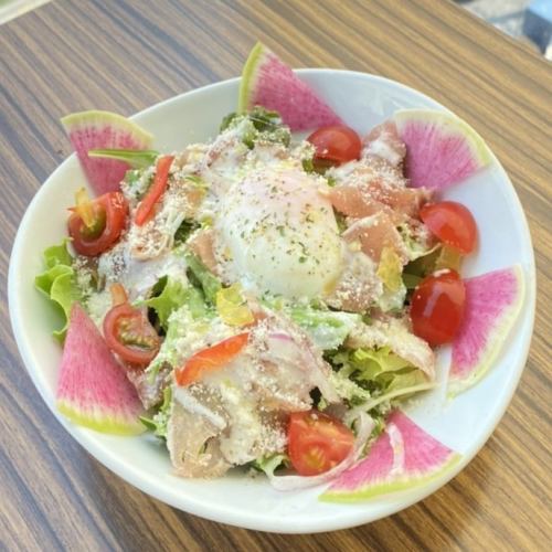 Italian salad with prosciutto and soft-boiled egg