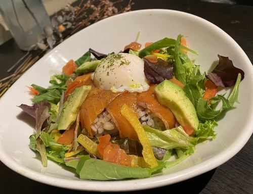Salmon and soft-boiled egg on avocado rice bowl
