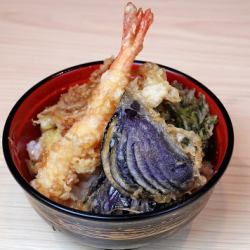 Bowl of rice and fried fish