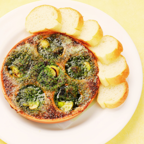 Oven-baked escargot and mushrooms with sliced bread