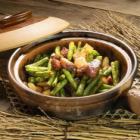 Stewed green beans and pork belly in a clay pot