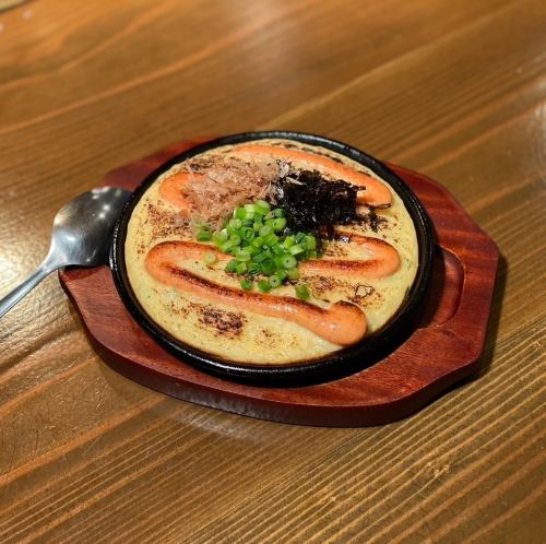 Yam and cod roe grilled on an iron plate