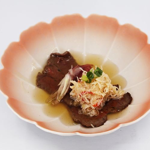 Thinly sliced charcoal-grilled Hokkaido beef aitchbone and snow crab served with Japanese broth