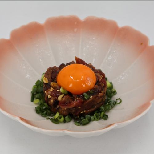 Seared beef and pine nuts in yukhoe style