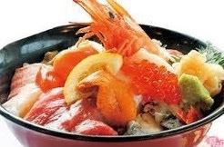 Bowl of rice topped with sashimi