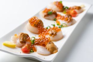 Luxurious scallop carpaccio with sea urchin and salmon roe