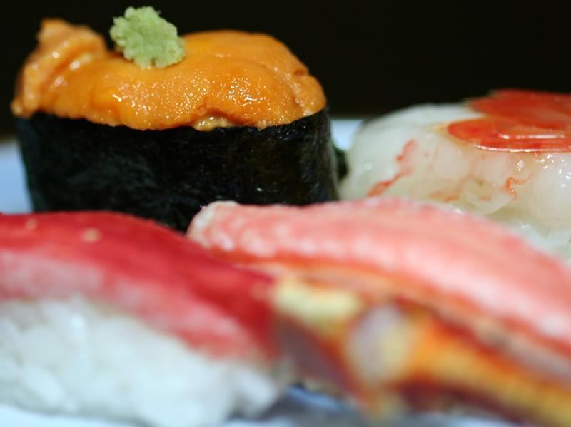 Assortment of four Hokkaido raw sushi pieces