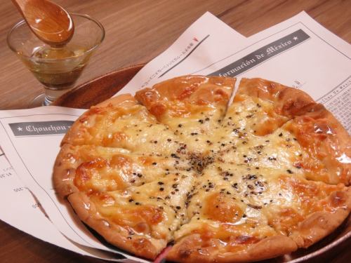 Dessert pizza with fragrant honey and 4 types of cheese