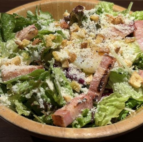 My Caesar salad topped with grilled bacon