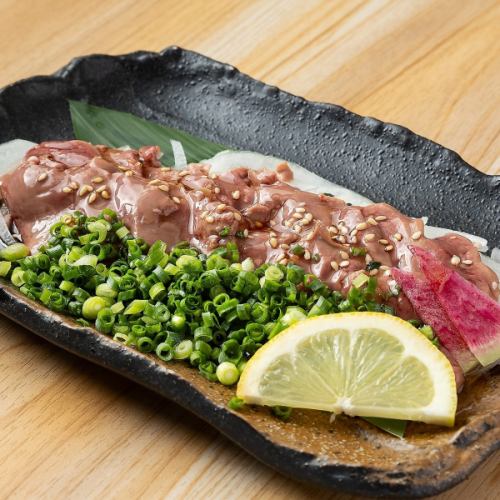 Low-temperature cooked chicken liver sashimi covered in green onions