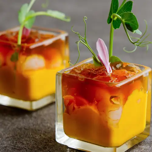 We want everyone to try one of our "Sea Urchin, Shrimp, Scallop, and Lobster Consommé Jelly with Seasonal Vegetable Fondant."
