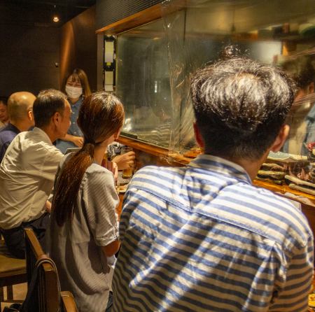 A fun counter seat where you can see the food being cooked in front of you!