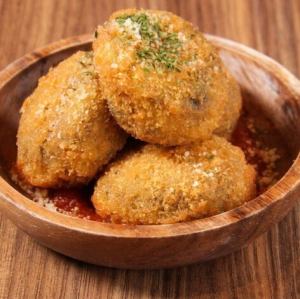 Squid ink rice croquettes
