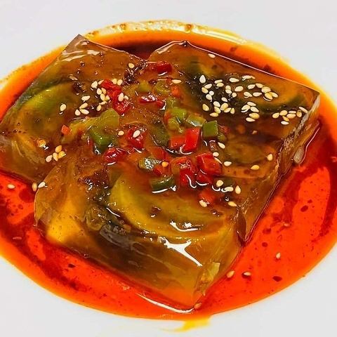 Century egg with Sichuan dressing and green onion roast pork