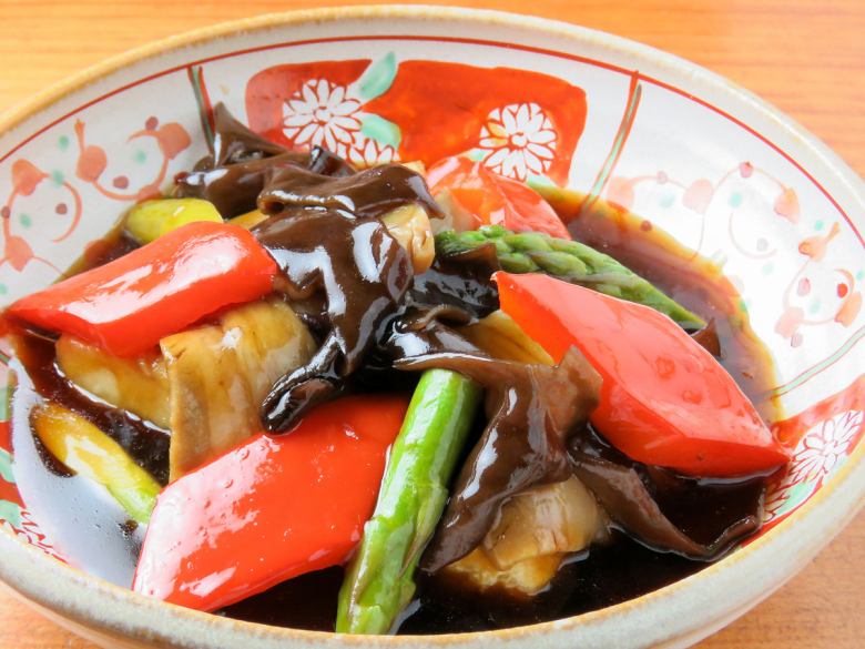 Black vinegar sweet and sour pork with tofu and vegetables