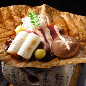 Kujo leek and duck grilled on a magnolia leaf