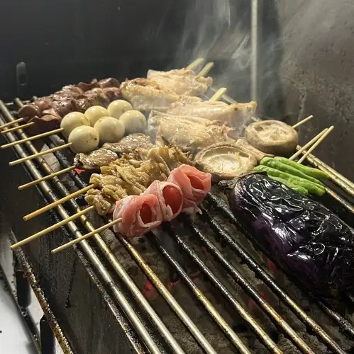 Our pride and joy: charcoal-grilled chicken skewers, grilled to perfection!