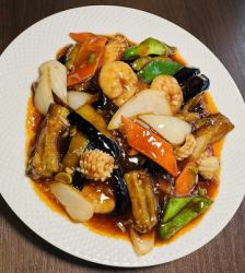 Stir-fried eggplant and seafood with spicy sweet and sour sauce