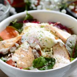 Caesar salad with soft-boiled egg and roasted chicken