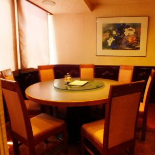 Semi-private room with round table seats for up to 8 people
