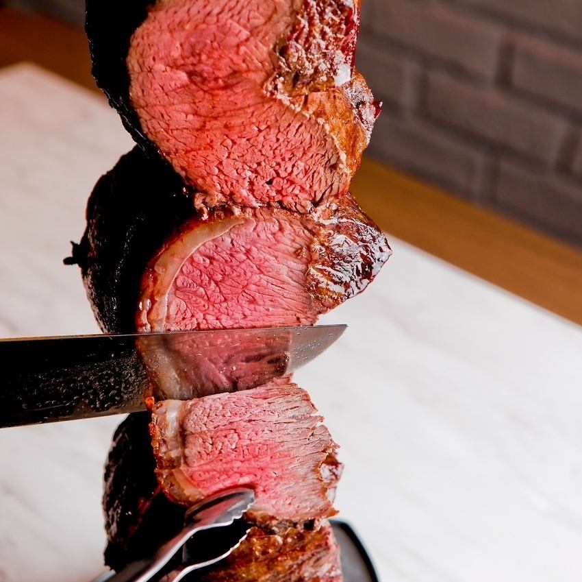 The meat being cut right in front of you is impressive! Enjoy all-you-can-eat churrasco