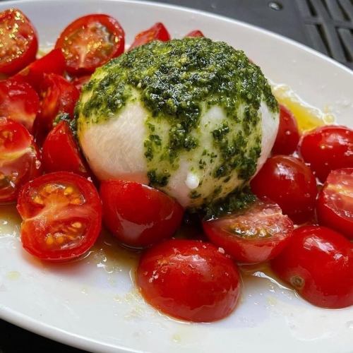 Burrata cheese whole and tomato caprese