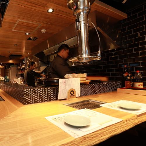 The counter seat in the foreground of the store.