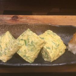 Dashi-wrapped egg with spring onion