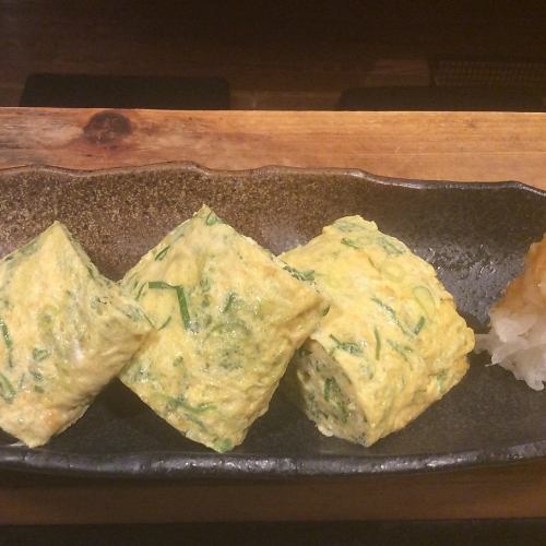 Dashi-wrapped egg with spring onion