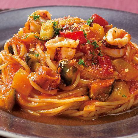 Colorful vegetables and Spanish pork in tomato sauce