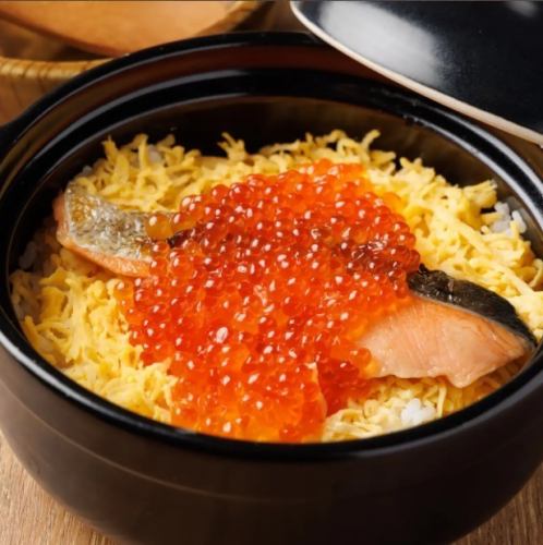 Salmon and salmon roe rice in clay pot