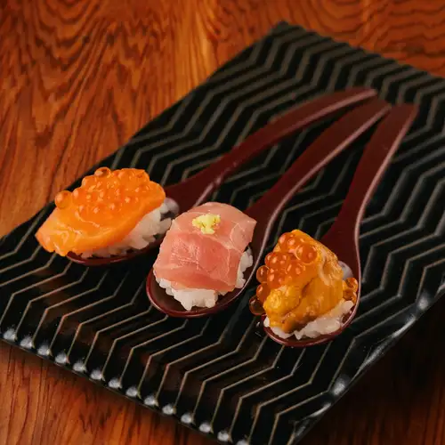 A dazzling array of seafood.Three kinds of blissful spoon sushi