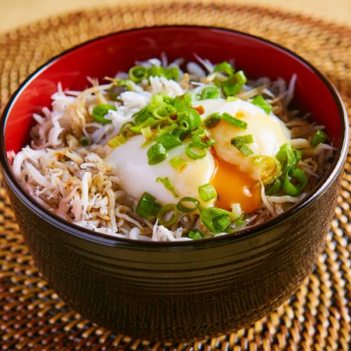 Whitebait rice bowl topped with soft-boiled egg
